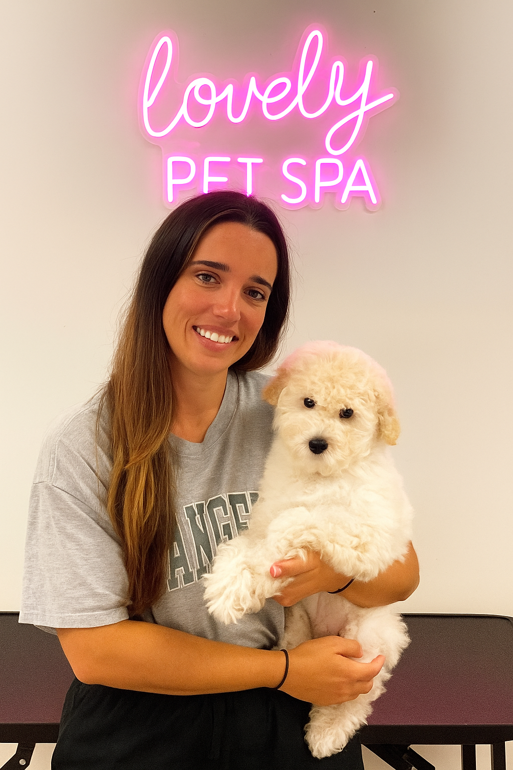 Owner holding a fluffy puppy at Lovely Pet Spa